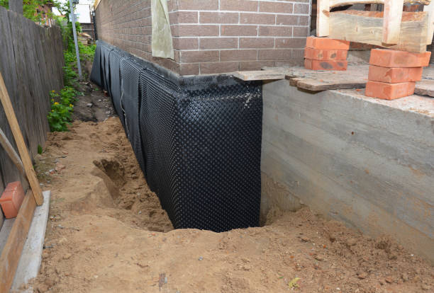 SJ Waterproofing Pros technician performing targeted Wet Basement Repair assessment in Mount Pleasant, TN